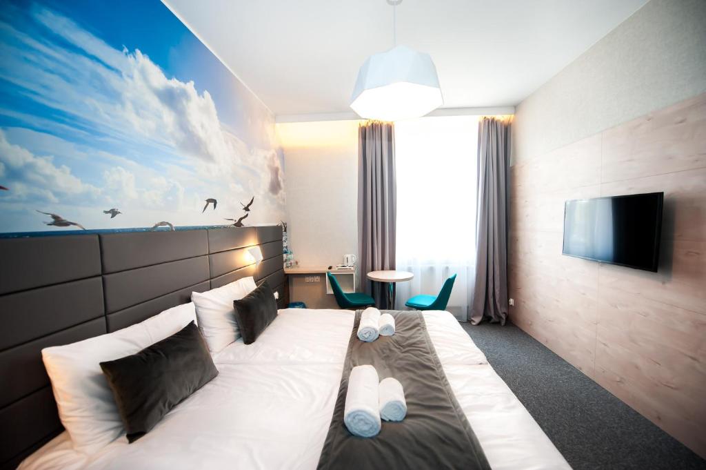 TV a/nebo společenská místnost v ubytování Hotel Gdynia Boutique