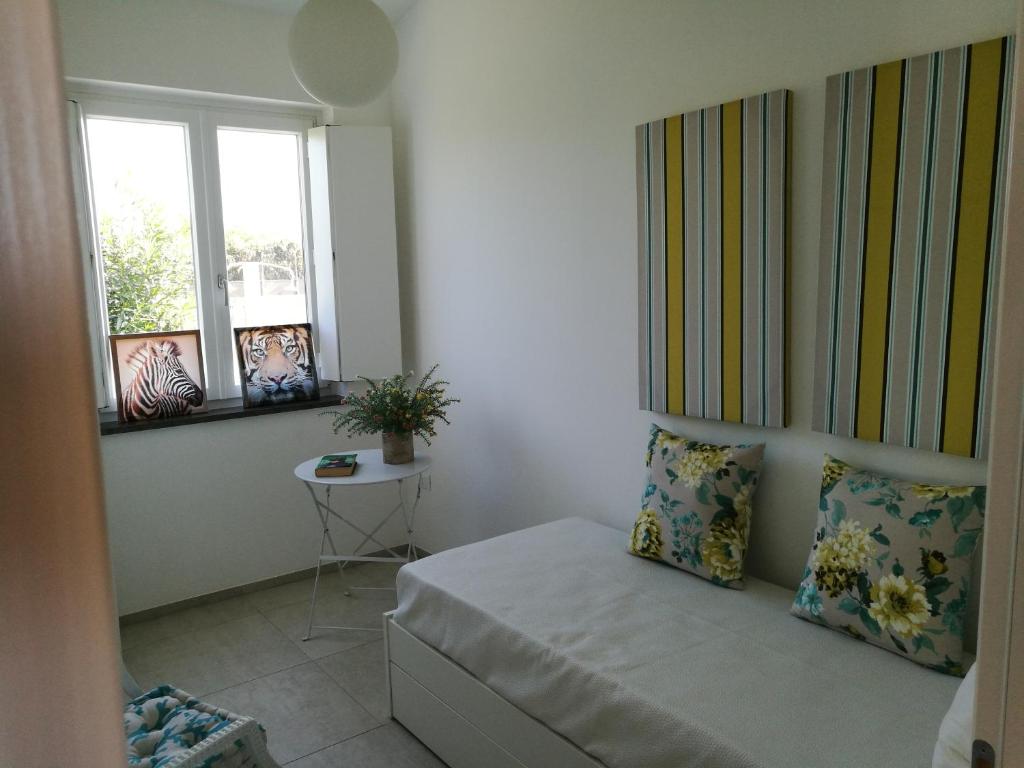 A bed or beds in a room at La Conchiglia