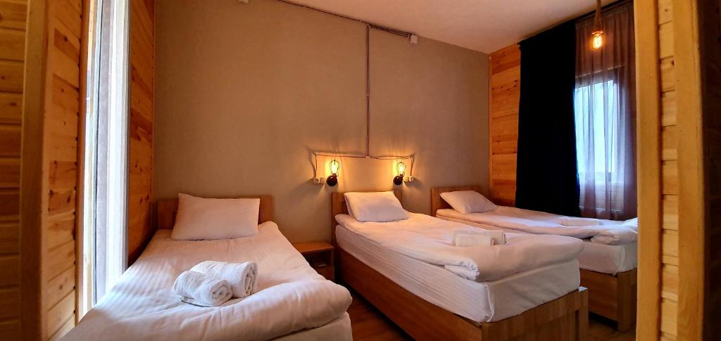 Letto o letti in una camera di Hotel Migu Yard