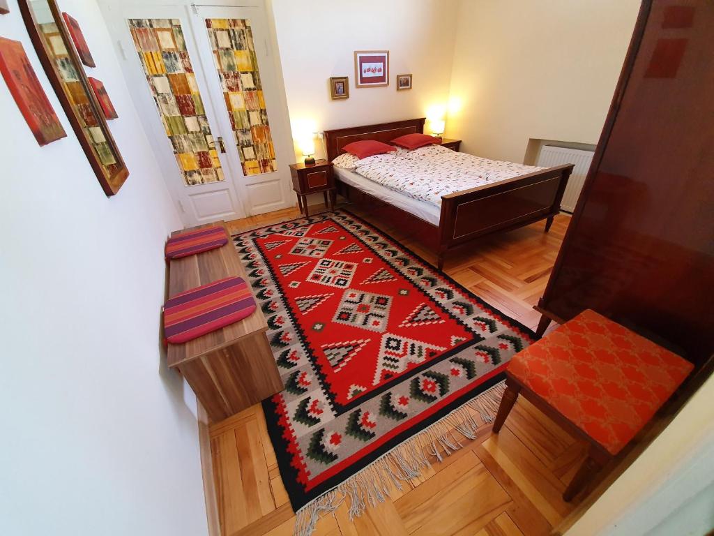 an aerial view of a bedroom with a bed and a rug at Odo's House in Tsinandali in Tsinandali