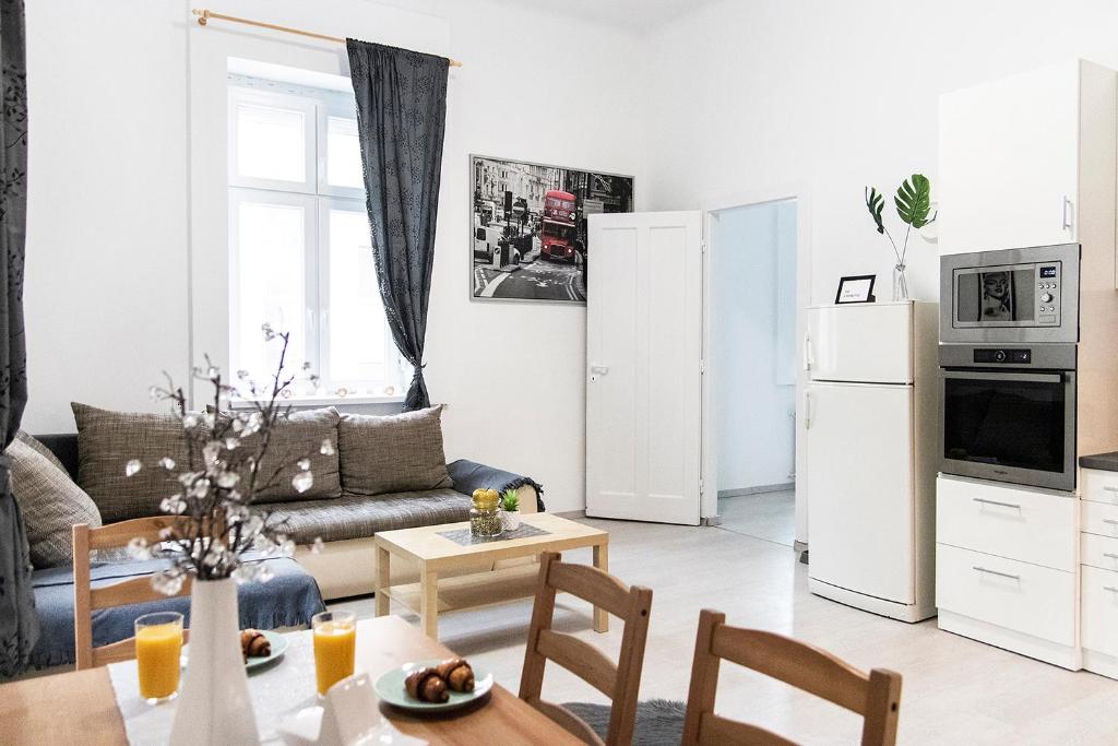 a living room with a couch and a table at Dora apartment near Buda Castle with PARKING! in Budapest