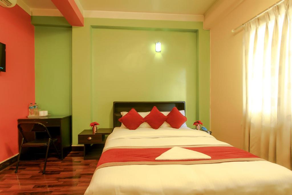 Postel nebo postele na pokoji v ubytování Hotel Nepalaya