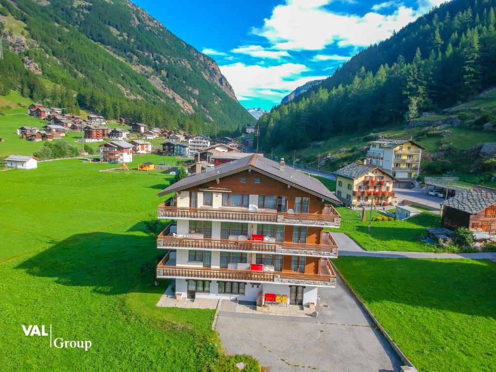 an aerial view of a village in the mountains at Haus Boccalino in Saas-Grund