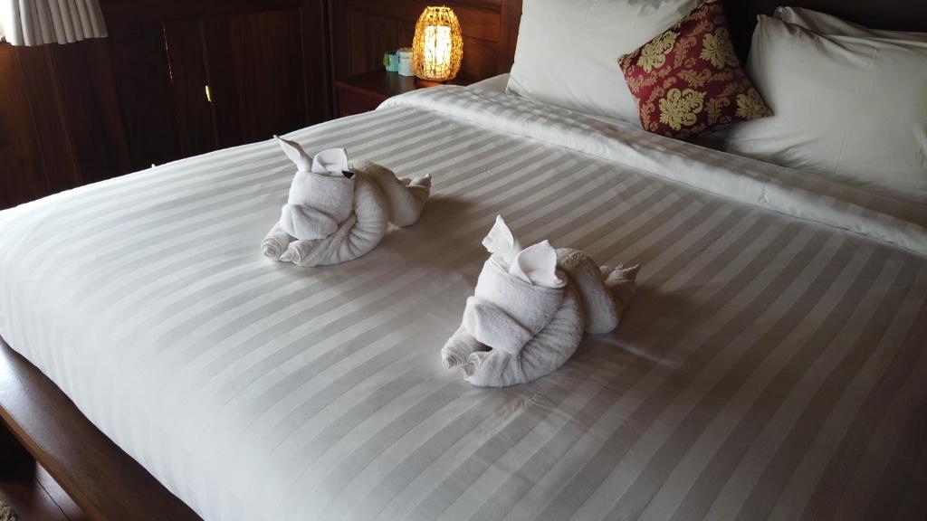 Postel nebo postele na pokoji v ubytování Villa Sindu Ubud