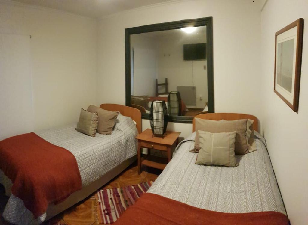 Voodi või voodid majutusasutuse Hostal Centro Montt toas