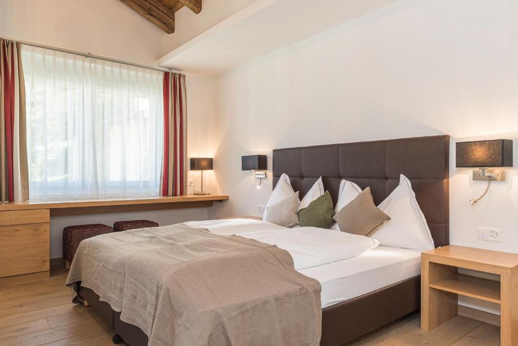 Postel nebo postele na pokoji v ubytování Matthiol Appartements