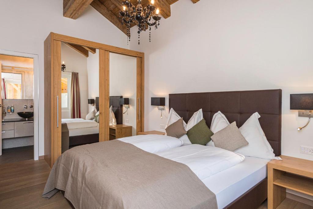 Postel nebo postele na pokoji v ubytování Matthiol Appartements