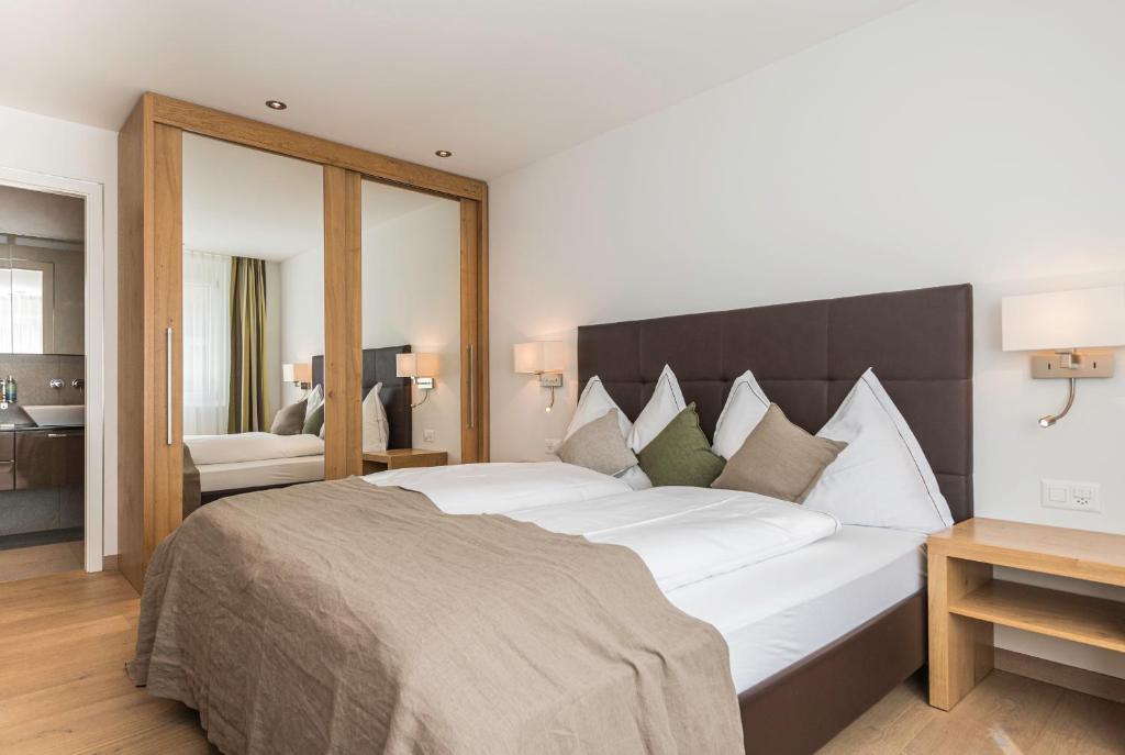 Postel nebo postele na pokoji v ubytování Matthiol Appartements