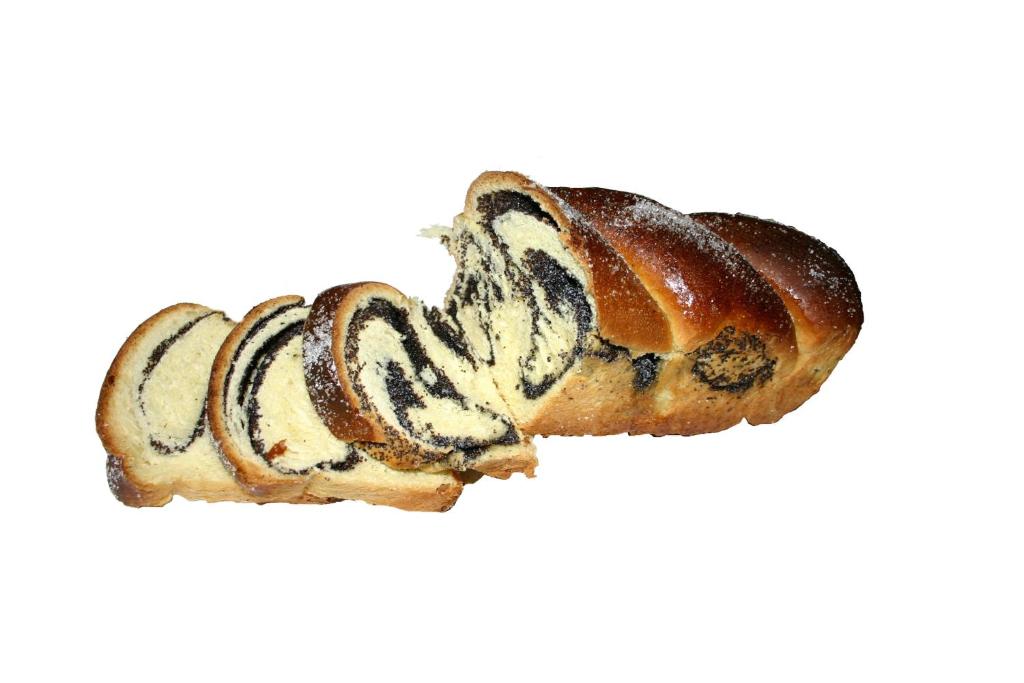 two croissants are sitting on a white background at Pension Mama Cozonacilor in Bran