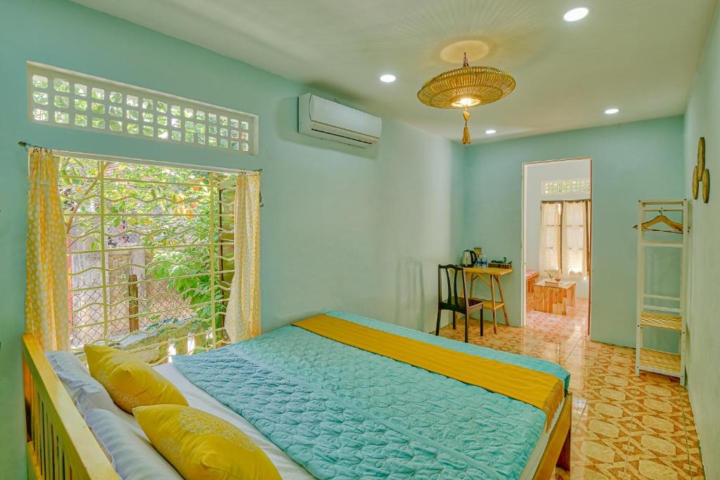 Postel nebo postele na pokoji v ubytování Le Robinet Homestay