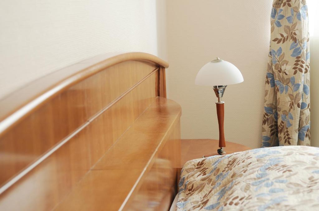 Postel nebo postele na pokoji v ubytování Amicus Hotel