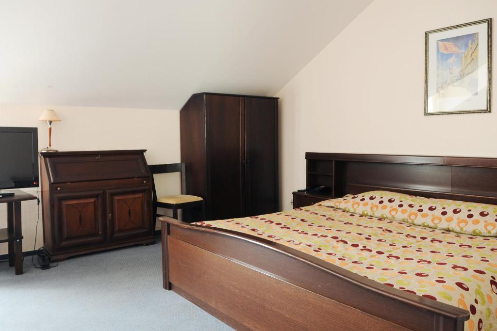Postel nebo postele na pokoji v ubytování Amicus Hotel