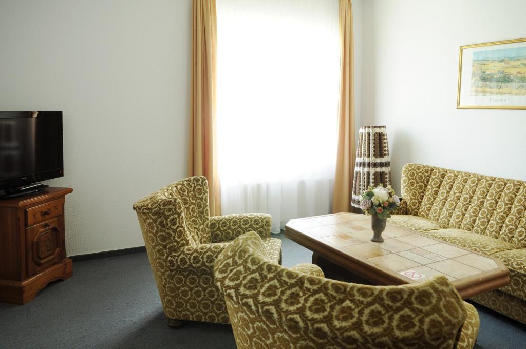 TV a/nebo společenská místnost v ubytování Amicus Hotel