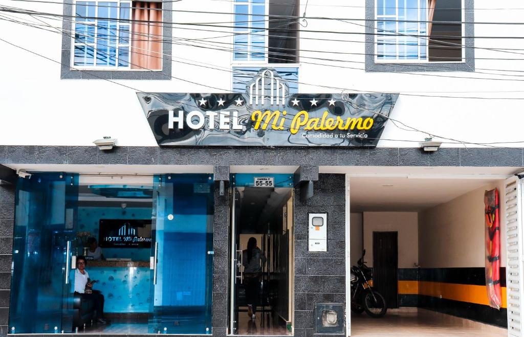 a hotel entrance with a sign on top of it at Hotel Mi Palermo in Bucaramanga