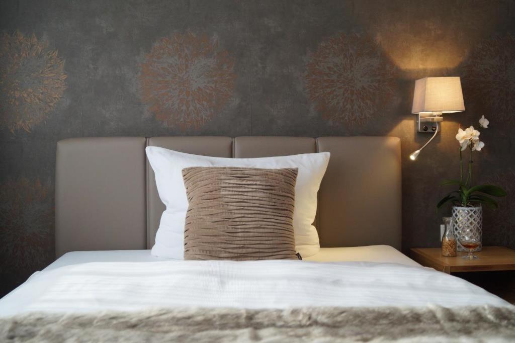 Postel nebo postele na pokoji v ubytování Hotel Hennemann