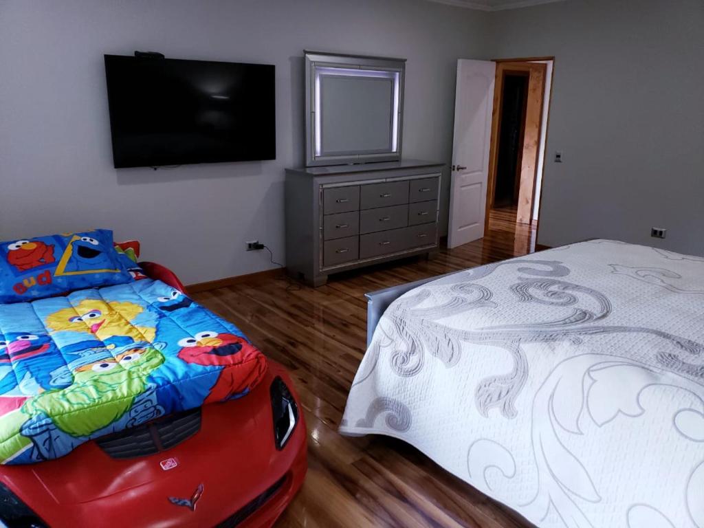 Postel nebo postele na pokoji v ubytování Cabañas el Dorado Pucón