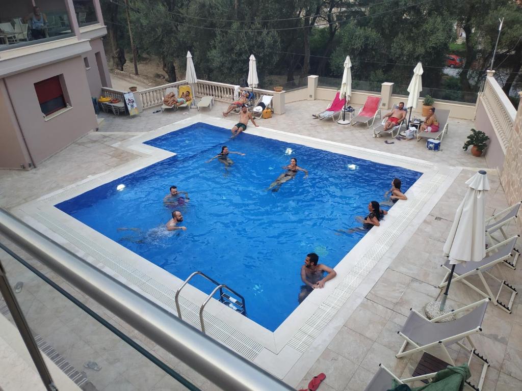 a group of people in a swimming pool at Michaelangelo in Parga