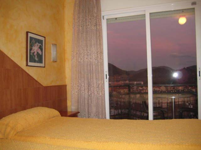 Postel nebo postele na pokoji v ubytování Hostal Sant Bernat