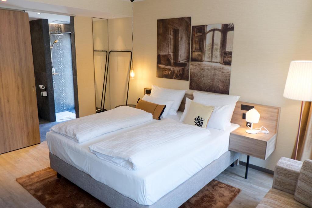 Postel nebo postele na pokoji v ubytování hôtel villa raab