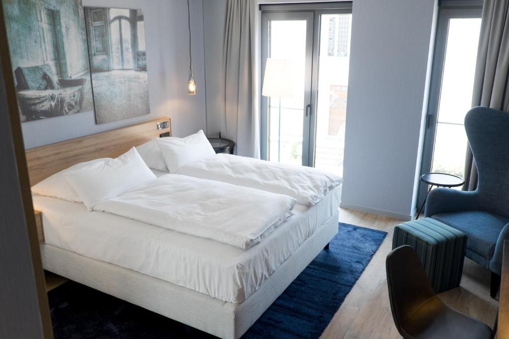 Postel nebo postele na pokoji v ubytování hôtel villa raab