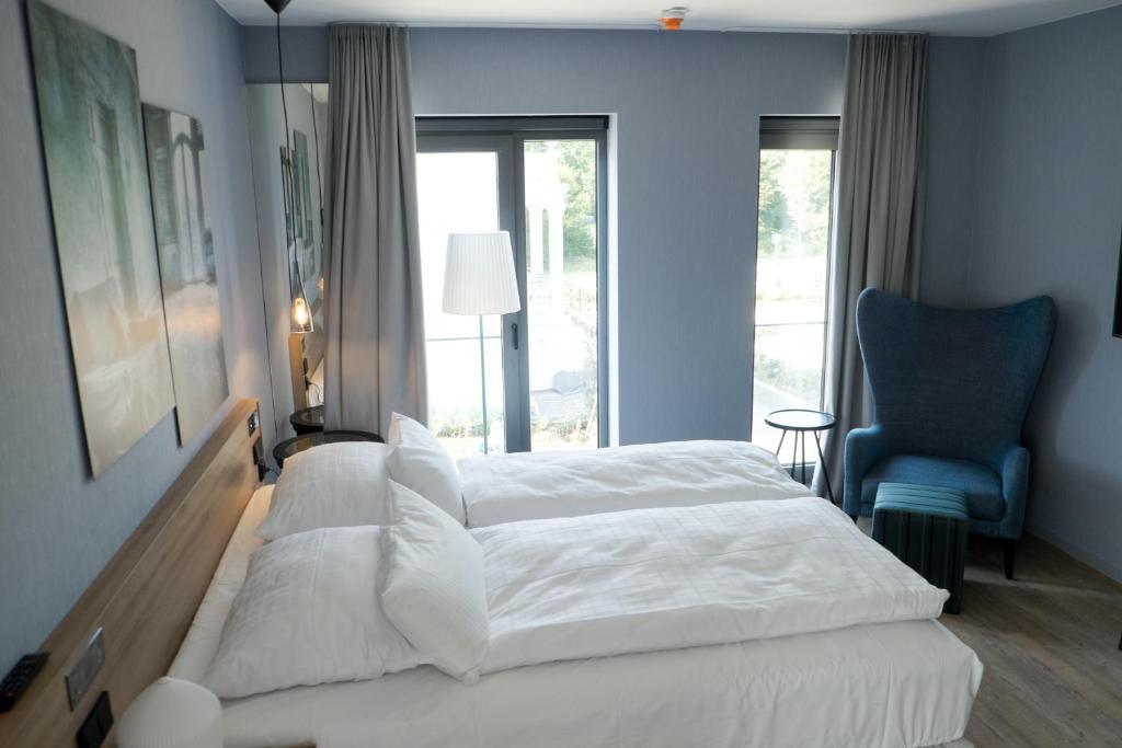 Postel nebo postele na pokoji v ubytování hôtel villa raab
