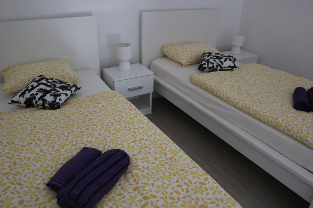 Postel nebo postele na pokoji v ubytování Apartment F6