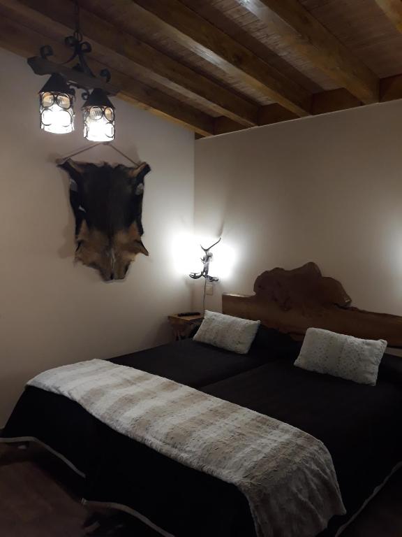 Postel nebo postele na pokoji v ubytování Las Cavernas Del Bisonte