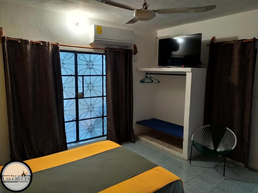 Una cama o camas en una habitación de Hostal Las Cruces