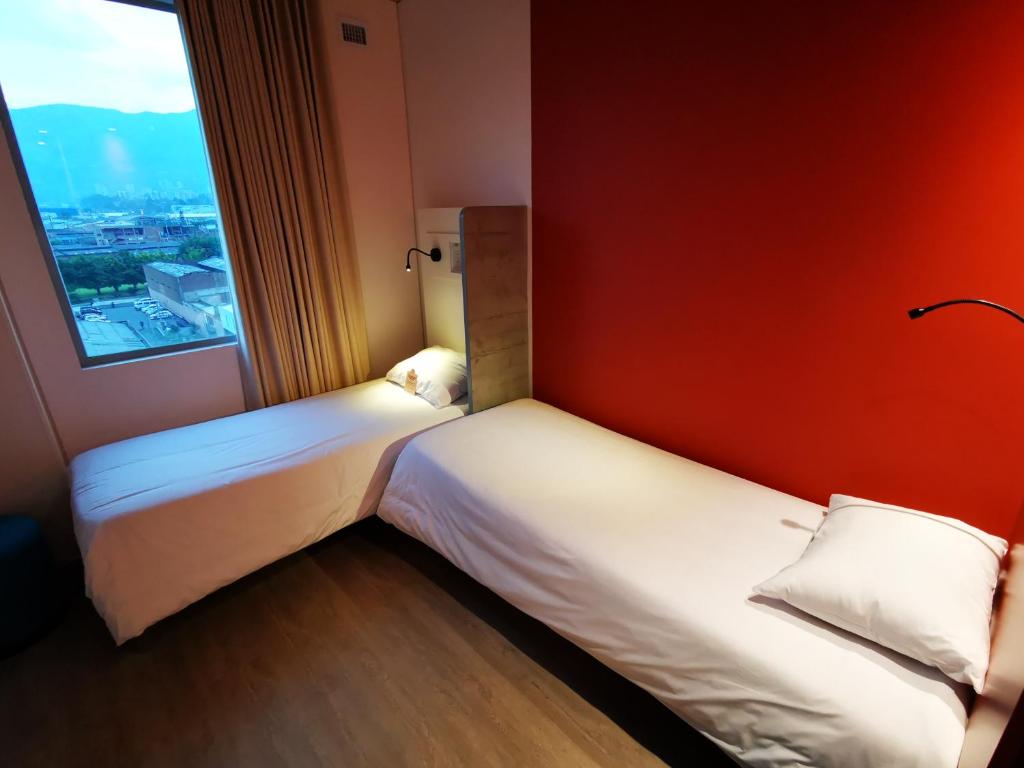 Postel nebo postele na pokoji v ubytování ibis budget Medellín Itagüí Metro