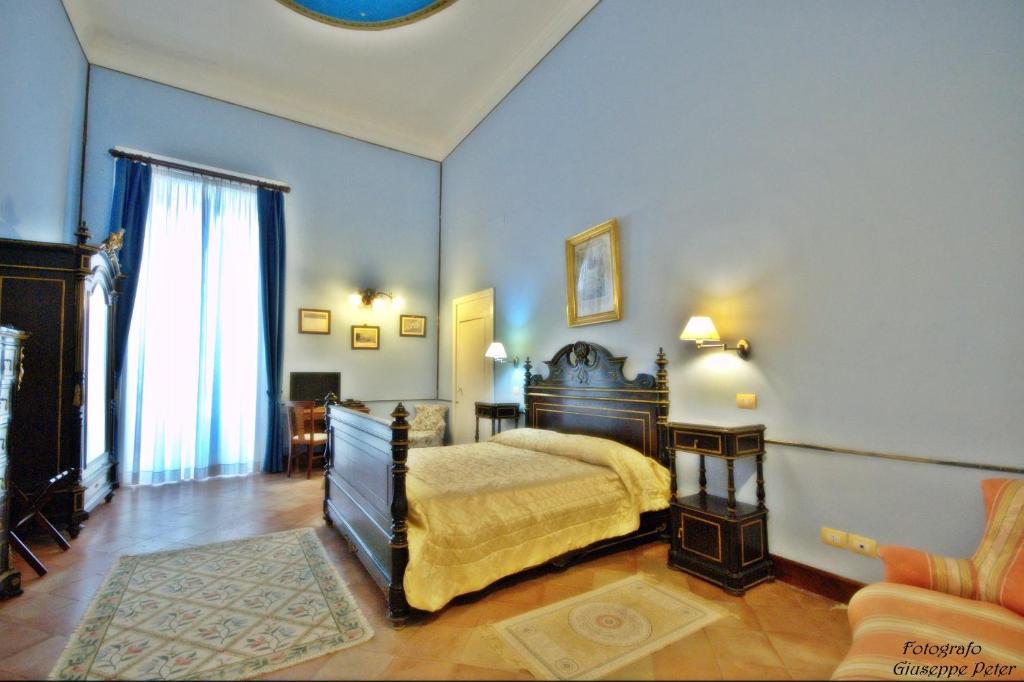 Un pat sau paturi într-o cameră la B&B Casa Cavalli