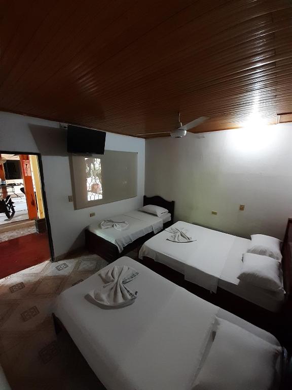 Postel nebo postele na pokoji v ubytování Hotel Sol y Mar