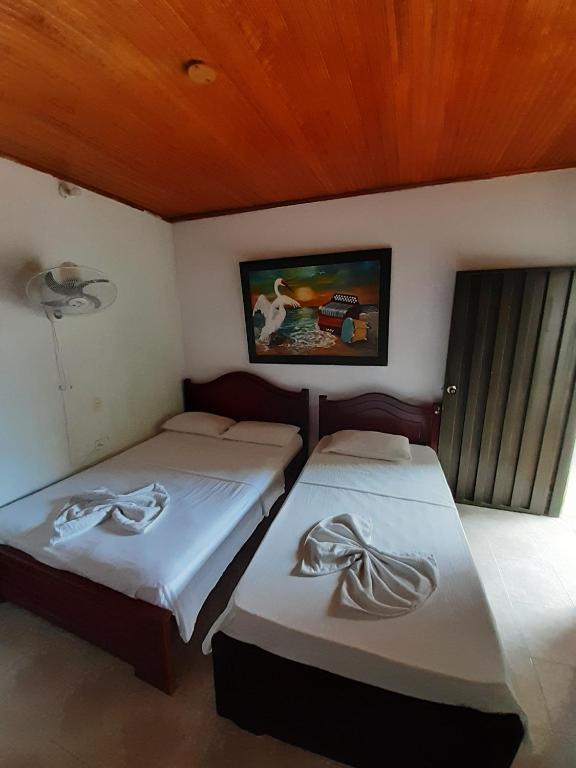 Postel nebo postele na pokoji v ubytování Hotel Sol y Mar
