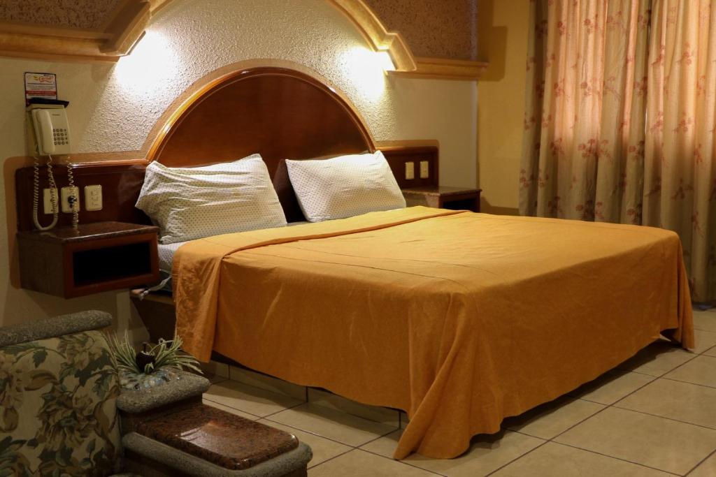 Postel nebo postele na pokoji v ubytování Motel Caribe