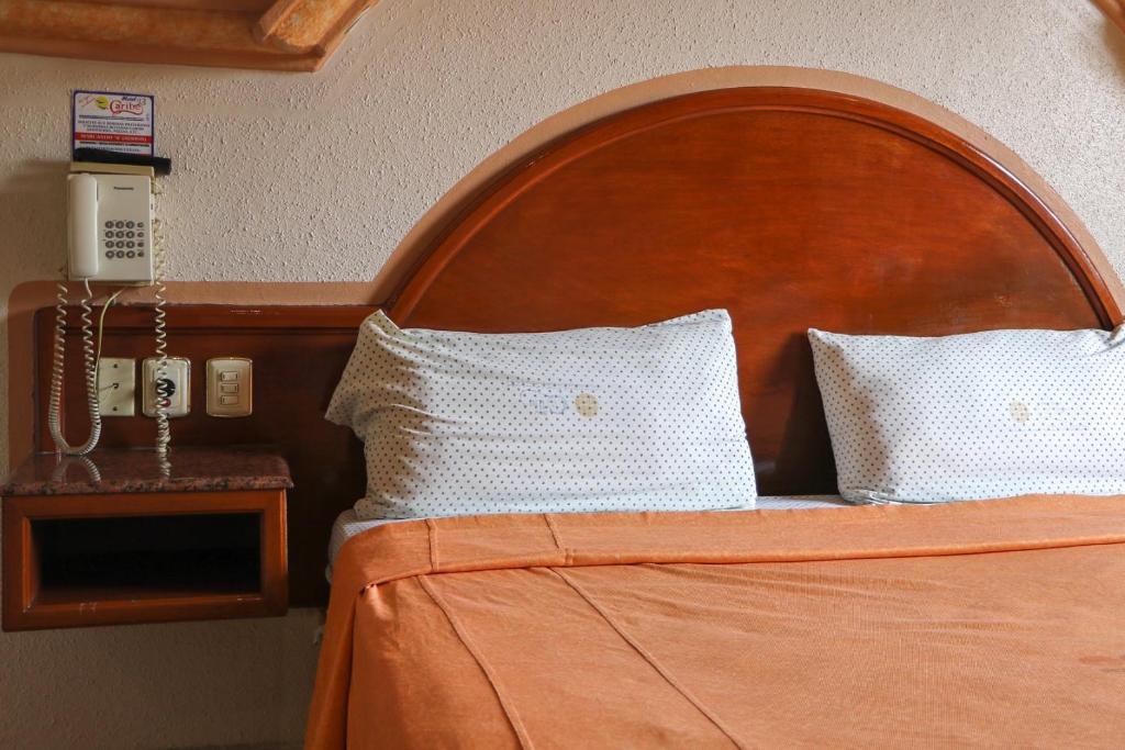 Postel nebo postele na pokoji v ubytování Motel Caribe