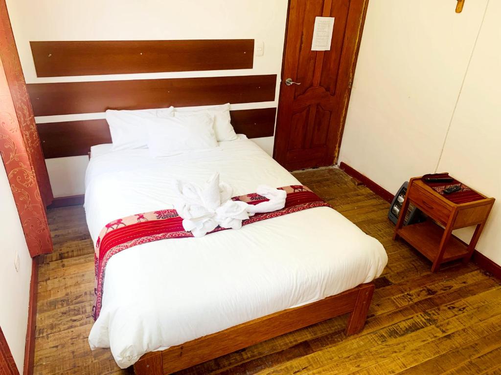 Postel nebo postele na pokoji v ubytování Inka Khawarina Tambo Lodge