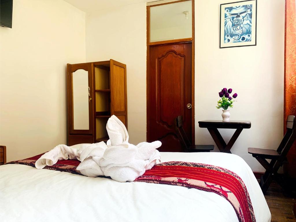 Postel nebo postele na pokoji v ubytování Inka Khawarina Tambo Lodge