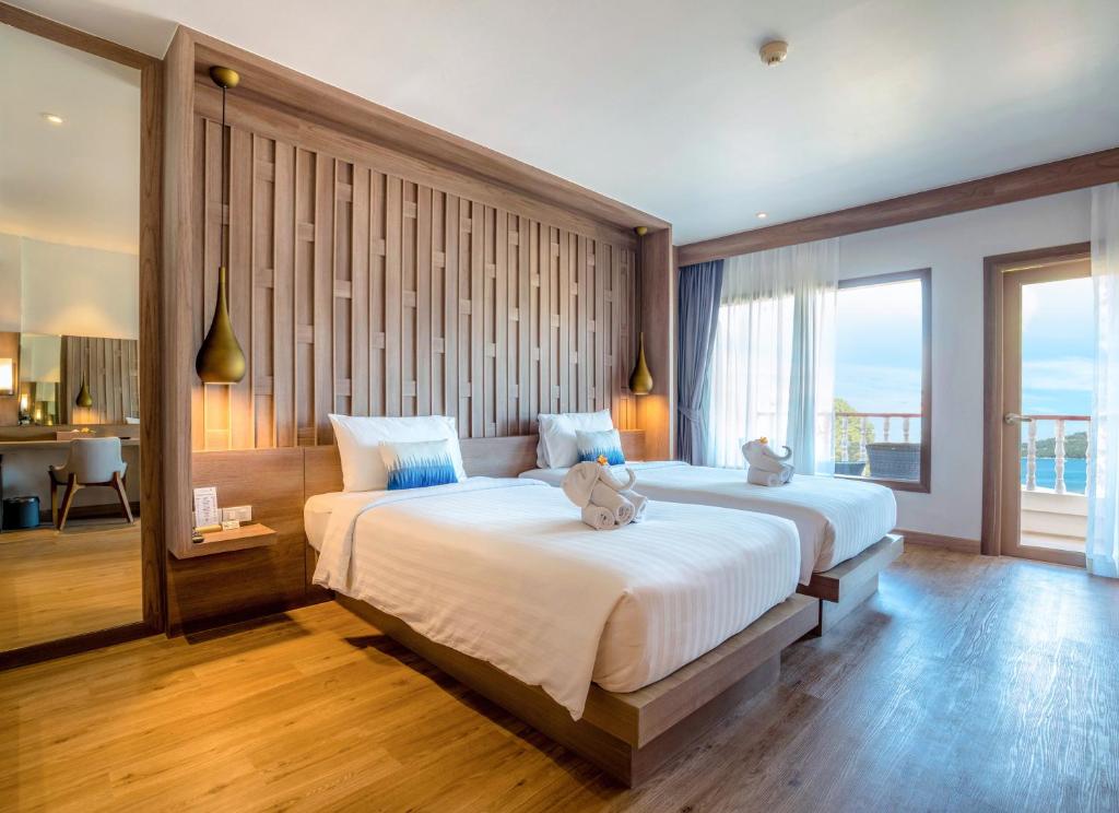 Postel nebo postele na pokoji v ubytování Namaka Resort Kamala
