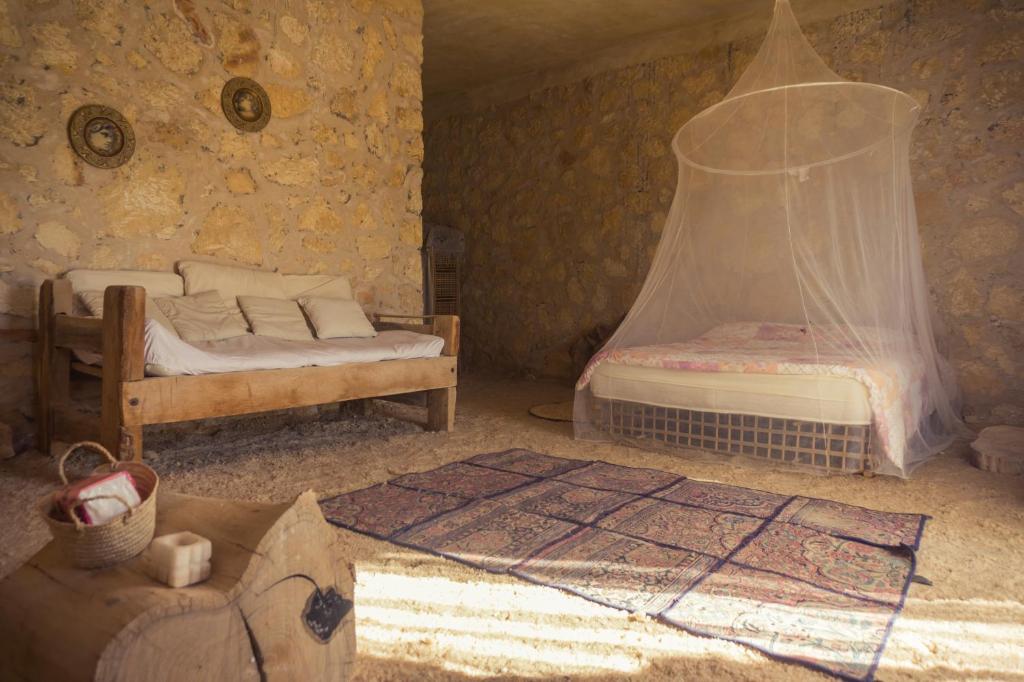 Postel nebo postele na pokoji v ubytování Siwa Relax Retreat Ecolodge
