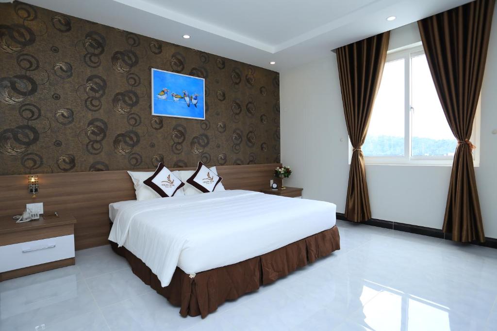 Phung Hung Boutique Hotelにあるベッド