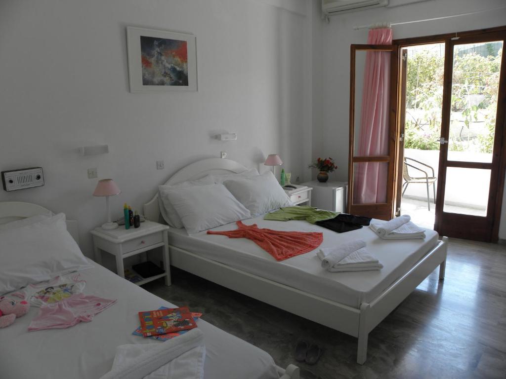 Postel nebo postele na pokoji v ubytování Areti Hotel