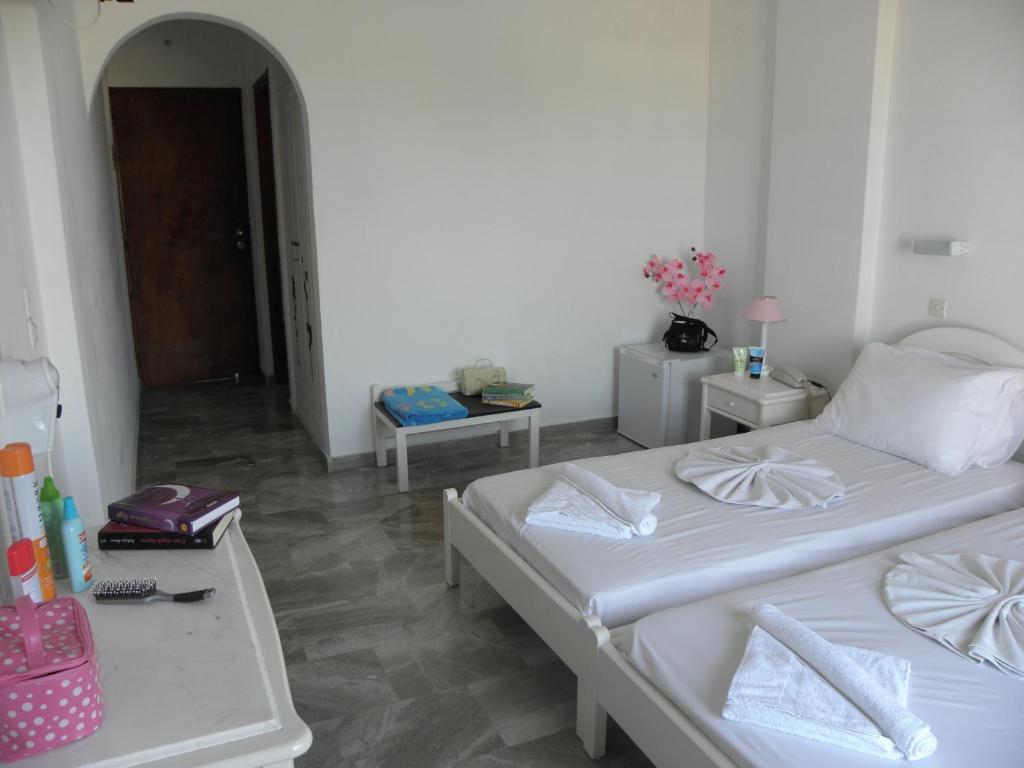 Postel nebo postele na pokoji v ubytování Areti Hotel
