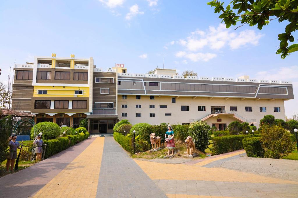 a building with people standing in front of it at Hotel Sunrise N Resorts in Nagpur