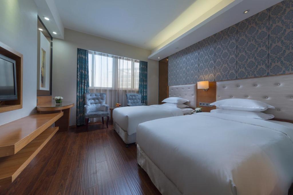 Postel nebo postele na pokoji v ubytování Holiday Inn Express Xiamen Lushan -Shopping Center by IHG