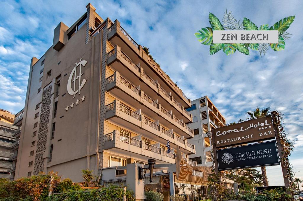 a building with a sign in front of it at Coral Hotel Athens in Athens