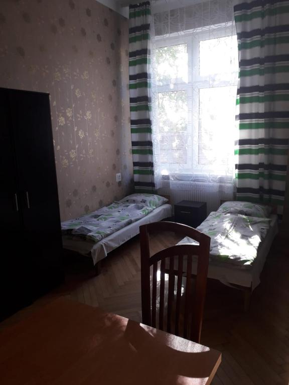 Posteľ alebo postele v izbe v ubytovaní mPark Noclegi Śląsk