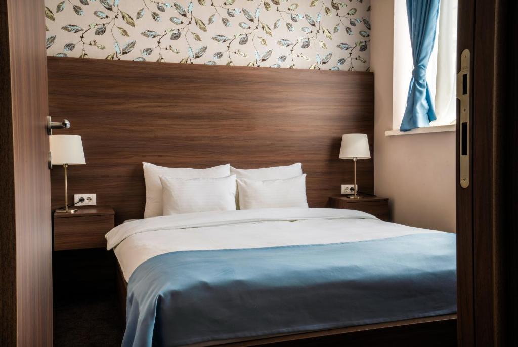 Postel nebo postele na pokoji v ubytování Veneti Suites
