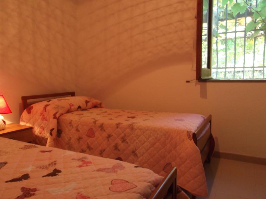 Postel nebo postele na pokoji v ubytování Agriturismo Collevento