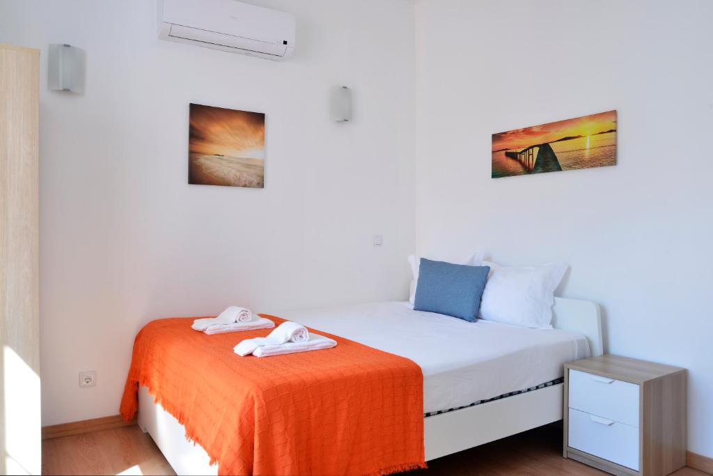 Postel nebo postele na pokoji v ubytování Oeiras 4 - Checkinhome