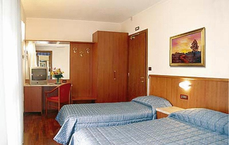 Postel nebo postele na pokoji v ubytování Hotel Dal Ponte