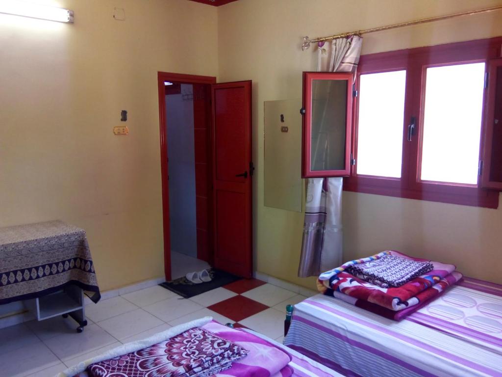 Postel nebo postele na pokoji v ubytování El-amin Guest House